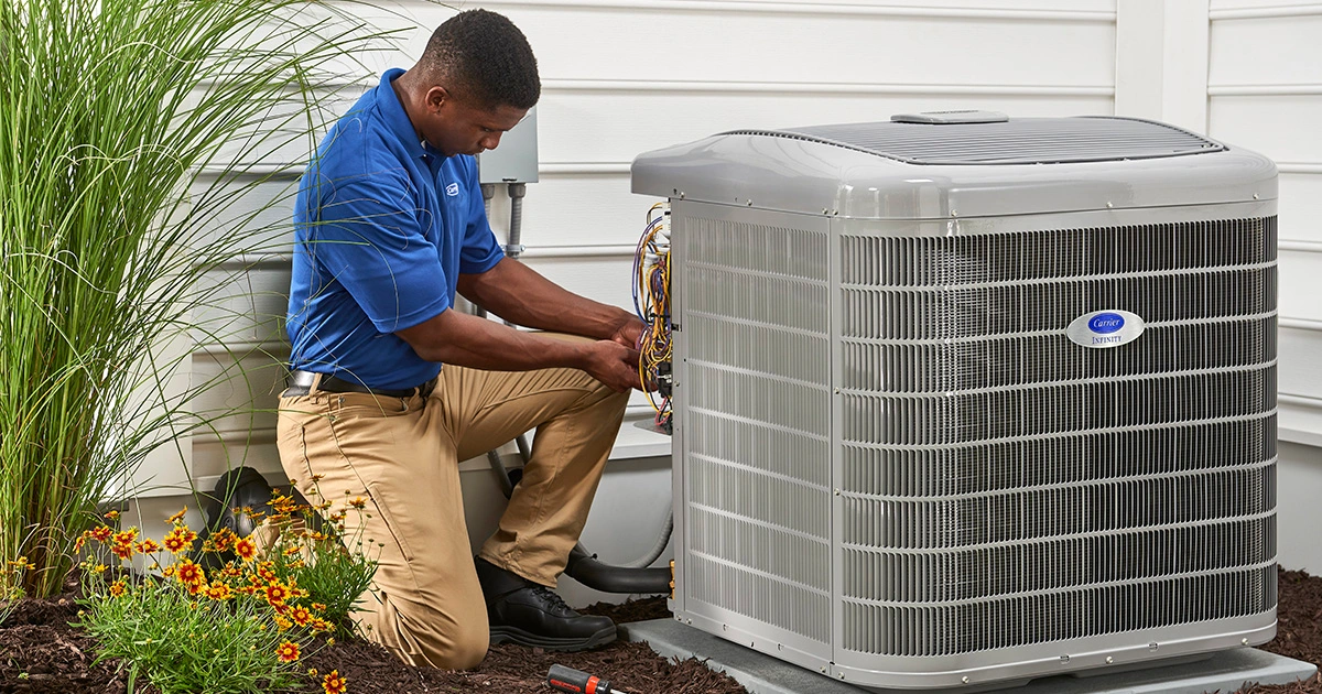 Man Working On A/C Unit HVAC Repair
